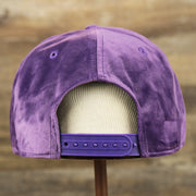 The backside of the Velour Blank Concord Grape Snapback Cap | Purple Snap Cap