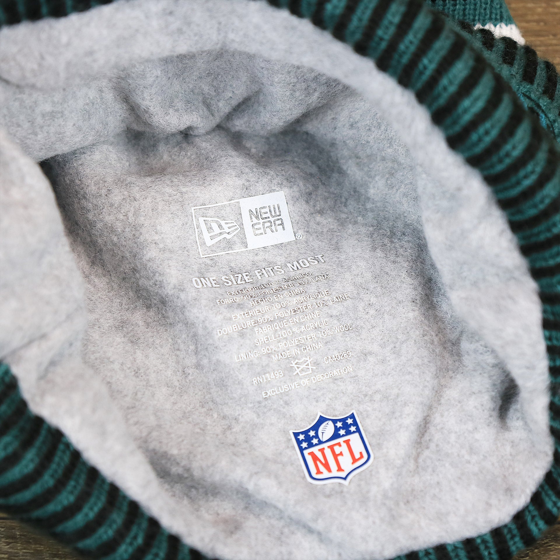 The Lining on the Philadelphia Eagles Patch 1933 On Field Striped Eagles Colorway Pom Pom Winter Beanie | Black and Midnight Green Winter Beanie