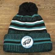 The front of the Philadelphia Eagles Patch 1933 On Field Striped Eagles Colorway Pom Pom Winter Beanie | Black and Midnight Green Winter Beanie