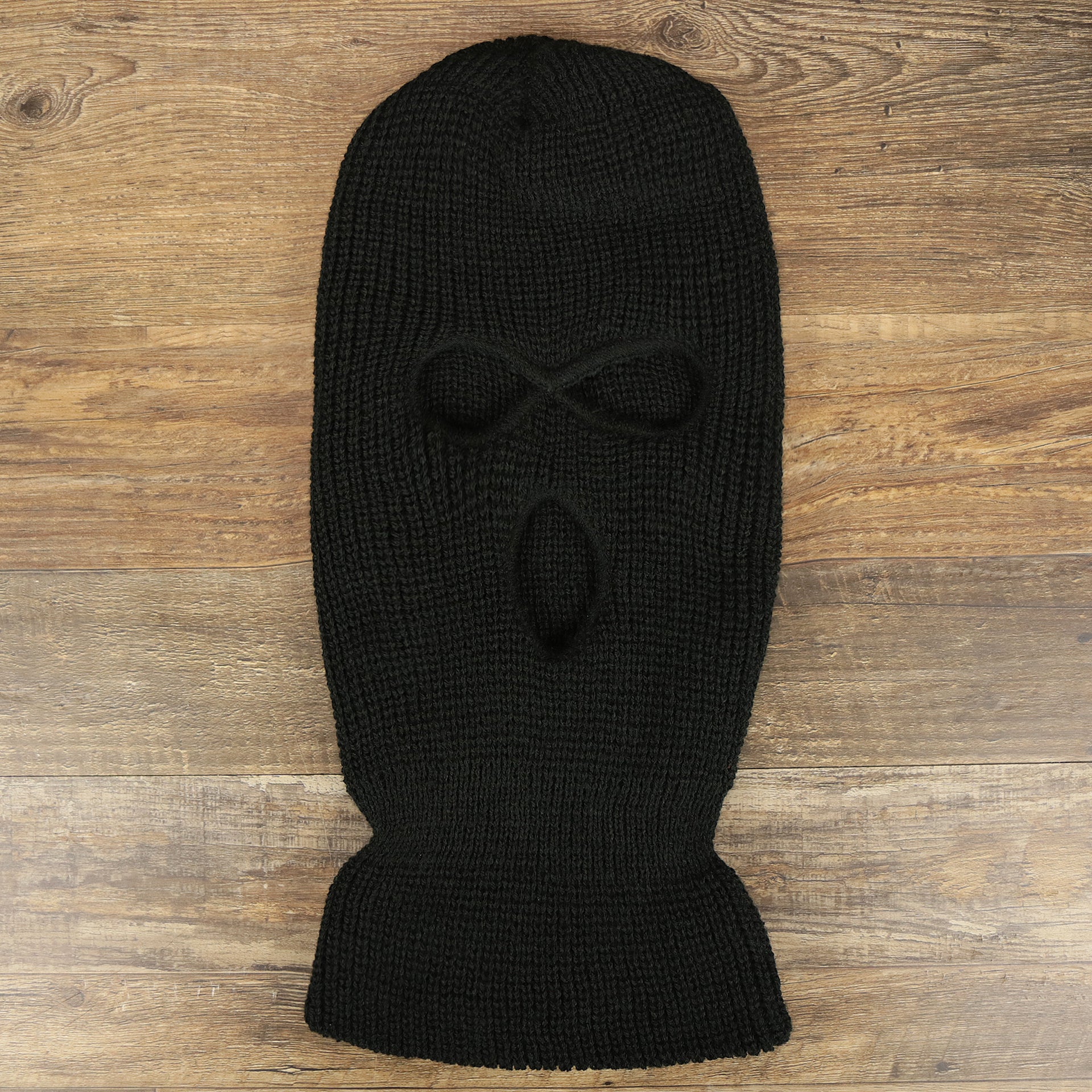 The Black Snug Fit Three Hole Balaclava | Black Knit Ski Mask on the ground