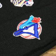The Blue Jays Logo on the Toronto Blue Jays All Over World Series Side Patch 2x Champion Knit Cuff Beanie | New Era, Black