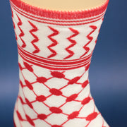 A close up of the Arabic Habibi Saudi Arabian Print Shin High Socks | Red And White Socks