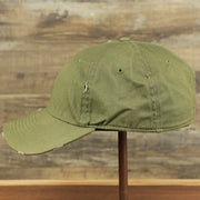 The wearer's left of the Olive Green Low Crown Distressed Adjustable Blank Baseball hat | Dark Green Dad Hat