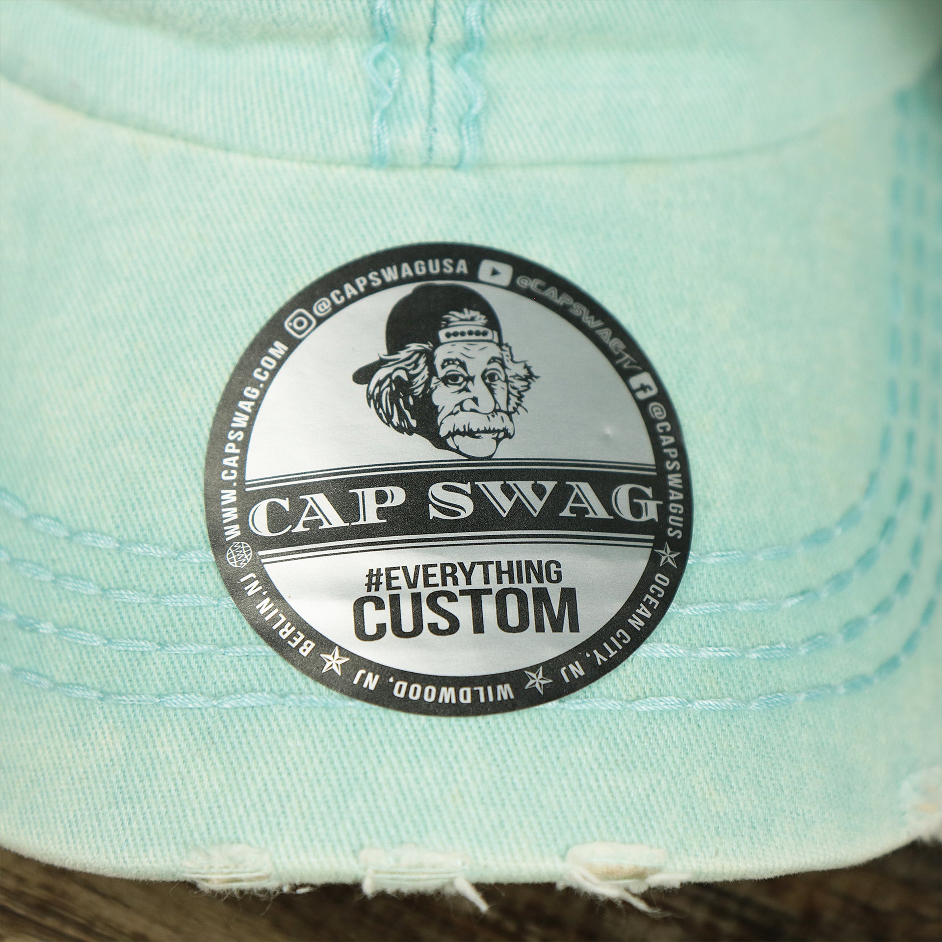 The Capswag Sticker on the Washed Pigment Blank Distressed Baseball Hat | Washed Mint Dad Hat