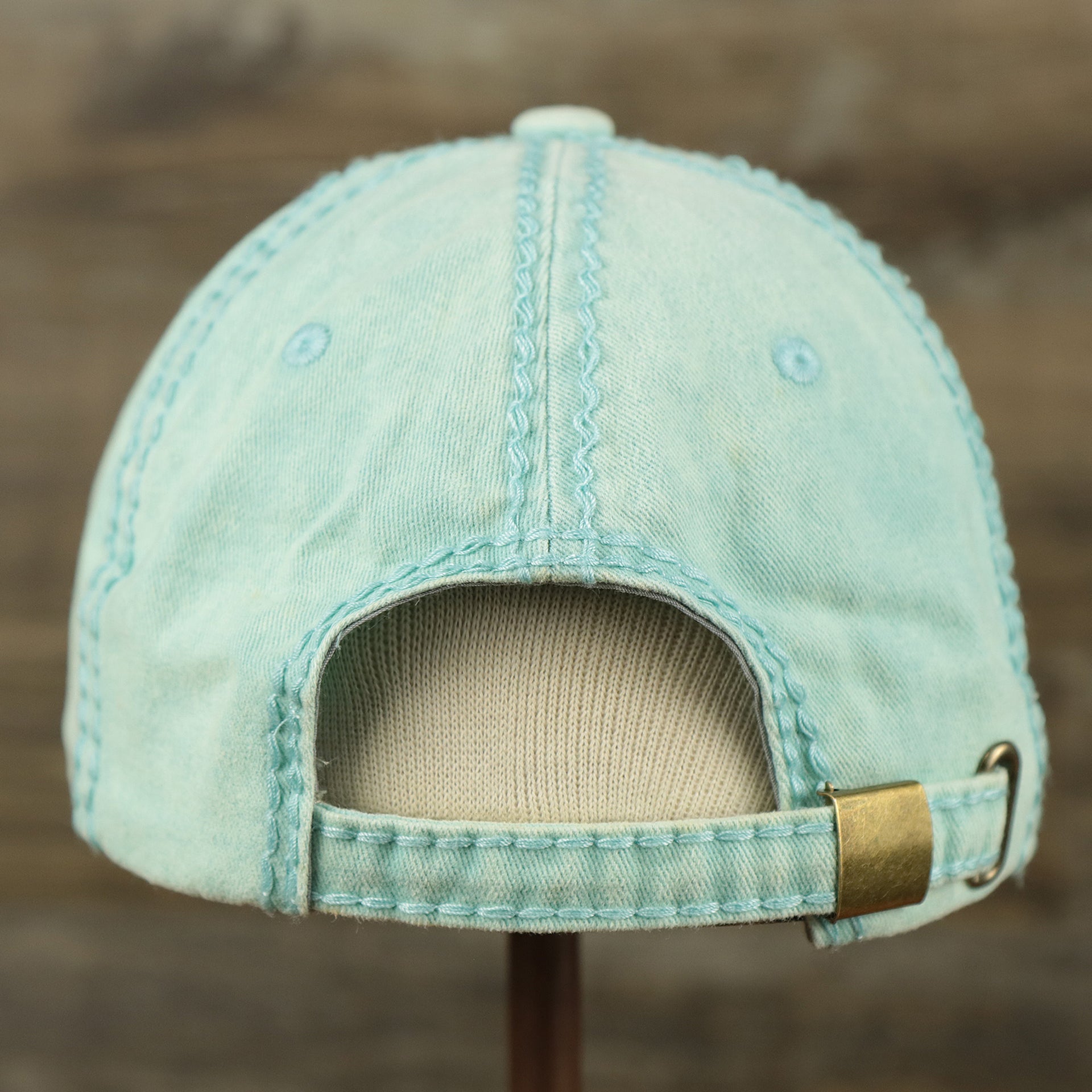 The backside of the Washed Pigment Blank Distressed Baseball Hat | Washed Mint Dad Hat