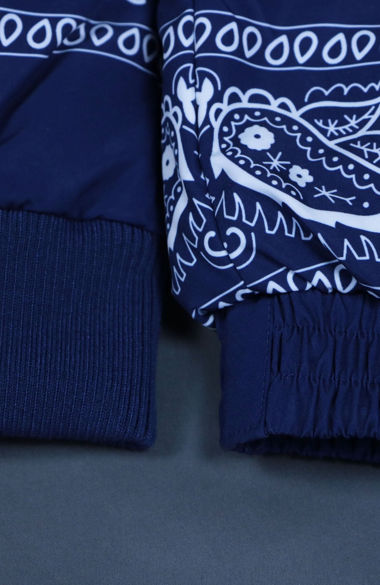 view of the cuffs Navy Bandanna Print Jacket | Classic Paisley Pattern Winter Jacket | Faux Vegan Fur Hood