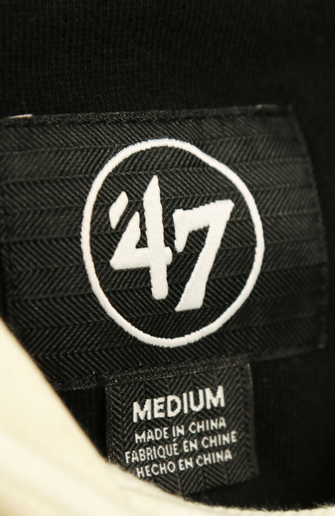 47 brand tag on the Philadelphia Flyers Vintage Hockey 47 Lacer Hoodie |  Black, Gray, White
