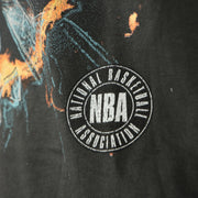 NBA circle logo on the front of the Philadelphia 76ers Flaming Basketball Shattering Glass Vintage Tubular Distressed T-Shirt | Flint Black