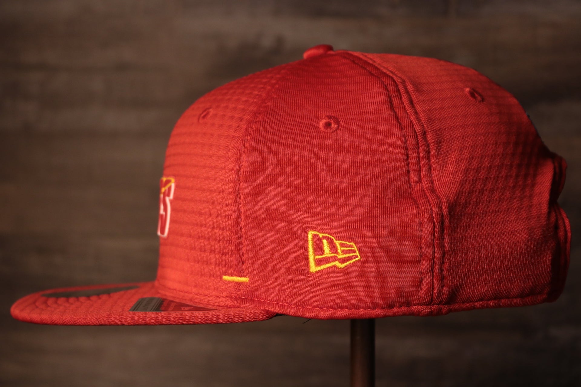 The wearers left side has the new era logo Chiefs 2020 Training Camp Snapback Hat | Kansas City Chiefs 2020 On-Field Red Training Camp Snap Cap