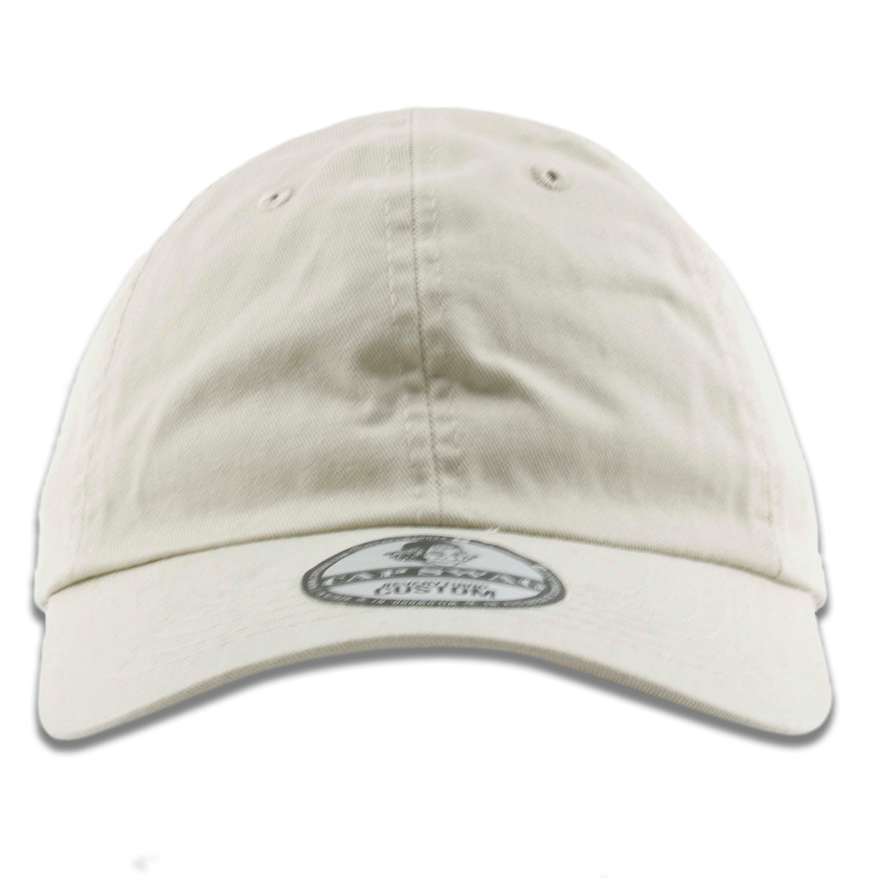 The ivory blank baseball cap has a soft unstructured crown and a bent brim