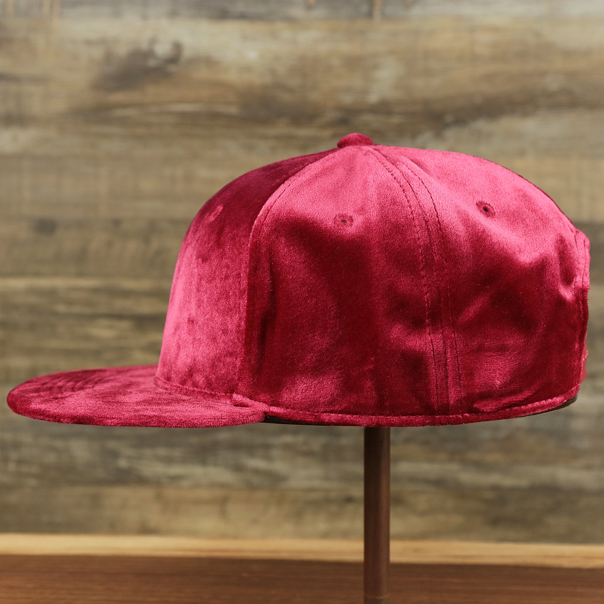 The wearer's left of the Velour Blank Ox Blood Snapback Cap | Dark Red Snap Cap