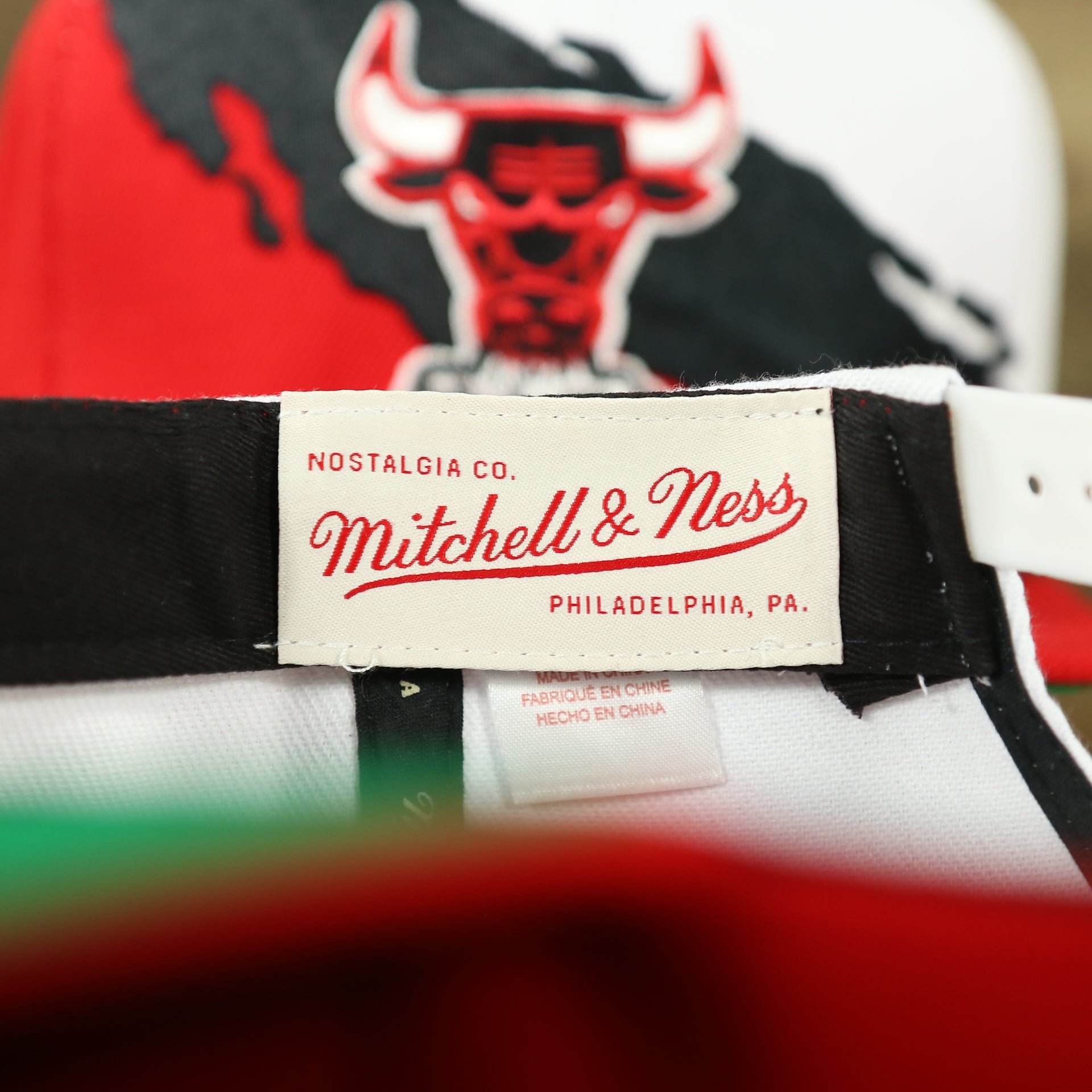 mitchell and ness tag on the Chicago Bulls Vintage Retro NBA Paintbrush Mitchell and Ness Snapback Hat | Red/White/Black