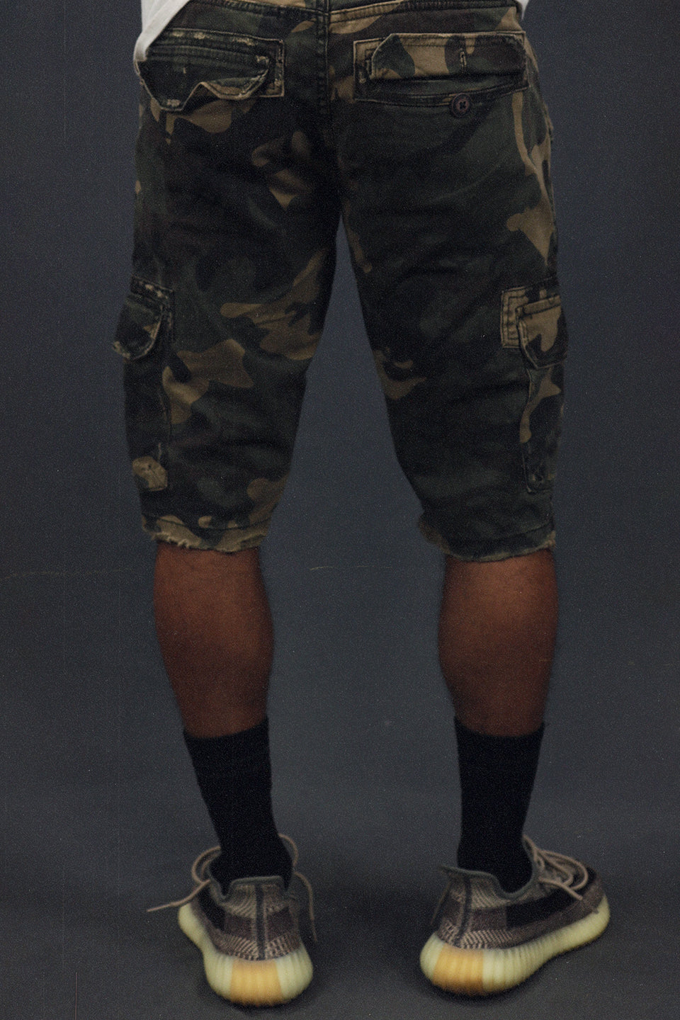 back of the Men's Ripped Woodland Camo Vintage Distressed Cargo Shorts | Woodland