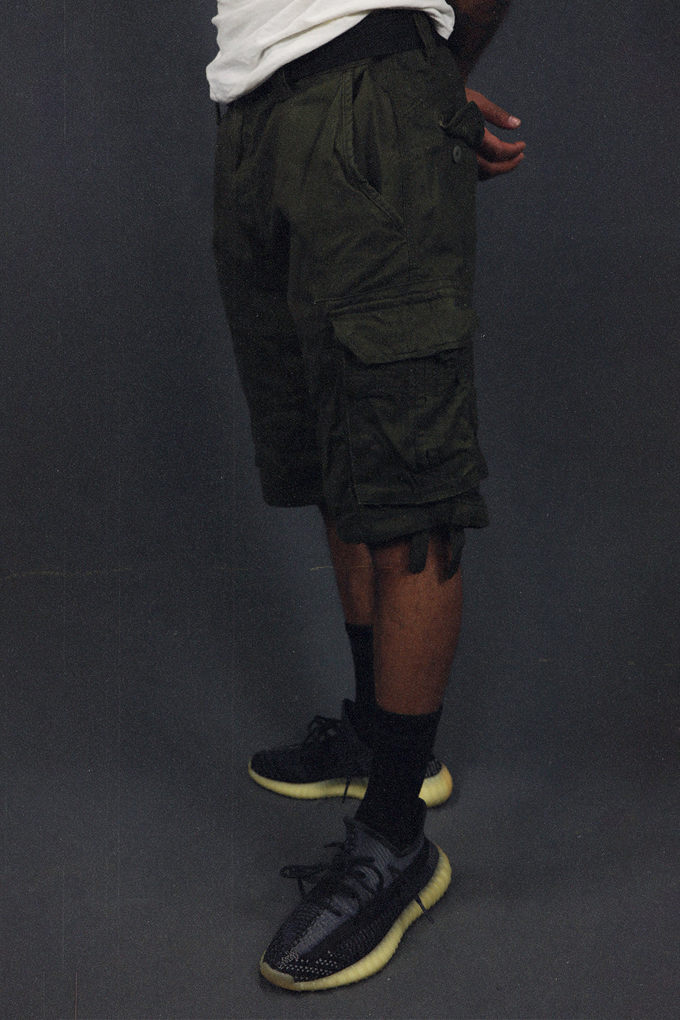 side view of the Men's Army Green Combat Shorts Six Pocket Cargo Shorts To Match Sneakers | Army Green
