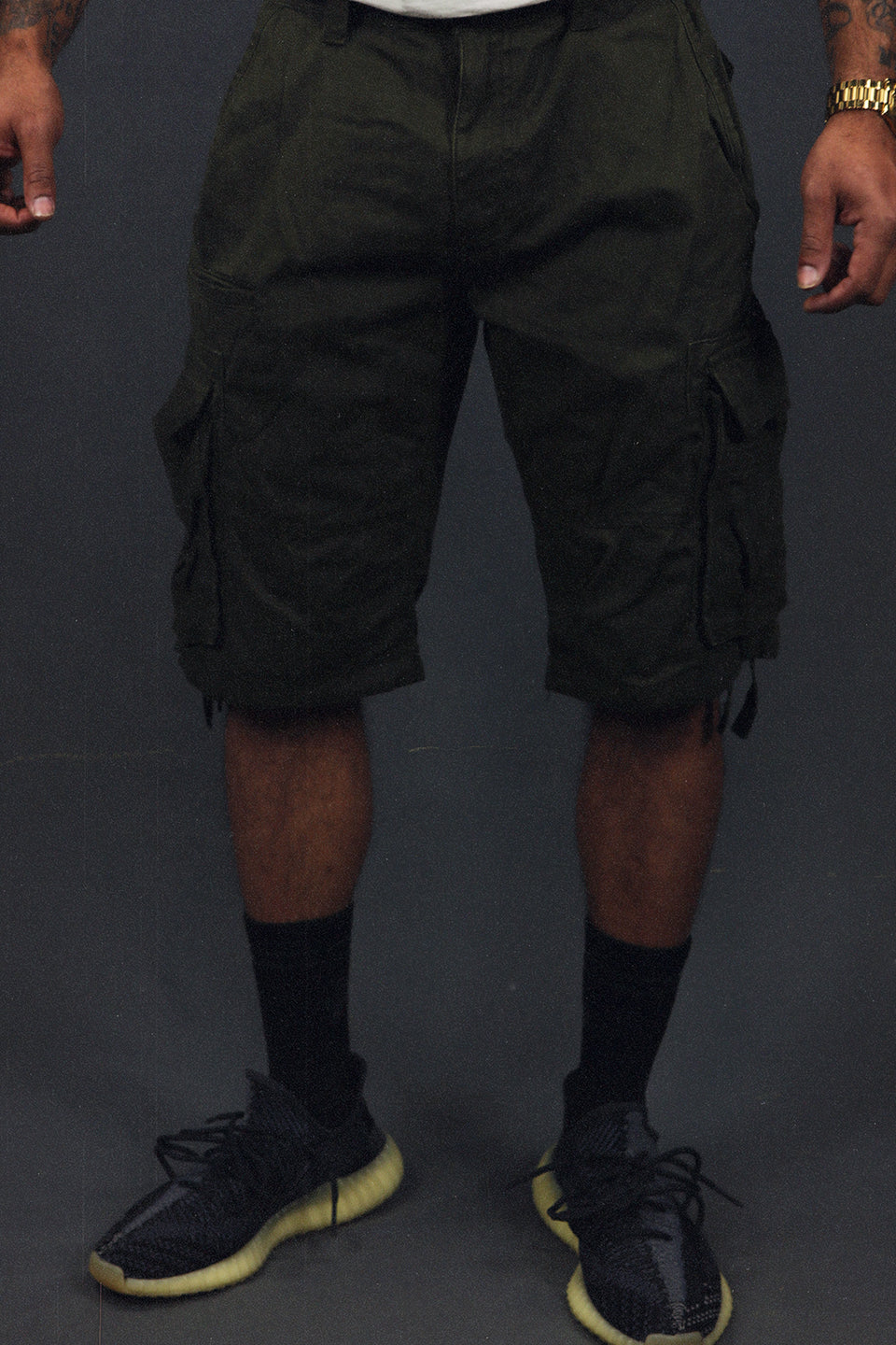 front of the Men's Army Green Combat Shorts Six Pocket Cargo Shorts To Match Sneakers | Army Green