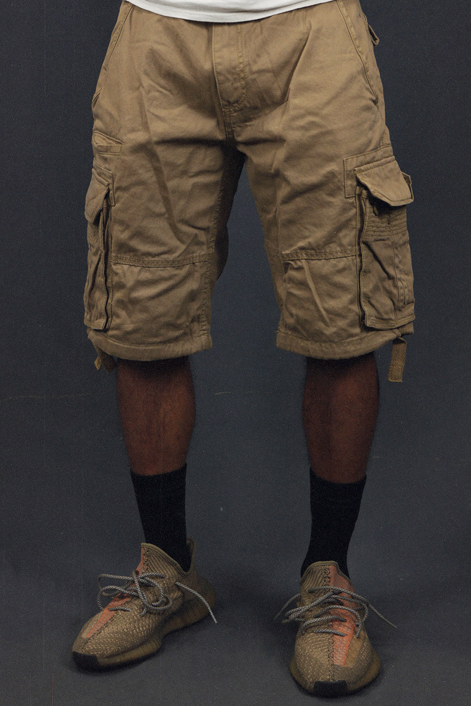 front of the Men's Khaki Combat Shorts Six Pocket Cargo Shorts To Match Sneakers | Khaki