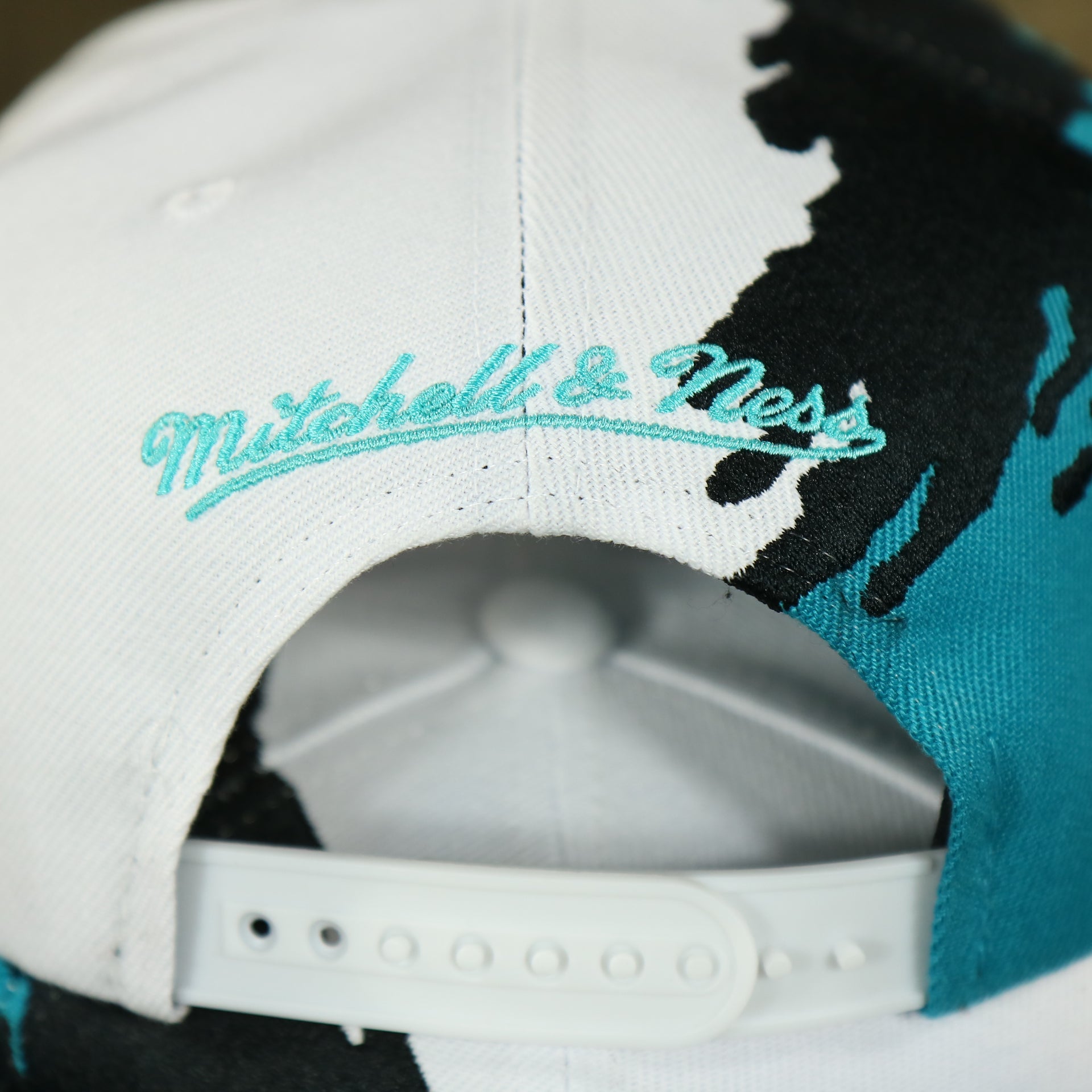 mitchell and ness logo San Antonio Spurs Vintage Retro NBA Paintbrush Mitchell and Ness Snapback Hat | Teal/White/Black