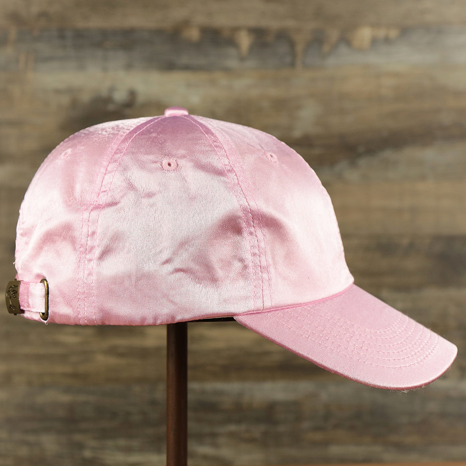 The wearer's right on the Satin Blank Cherry Blossom Pink Baseball Hat | Light Pink Dad Hat