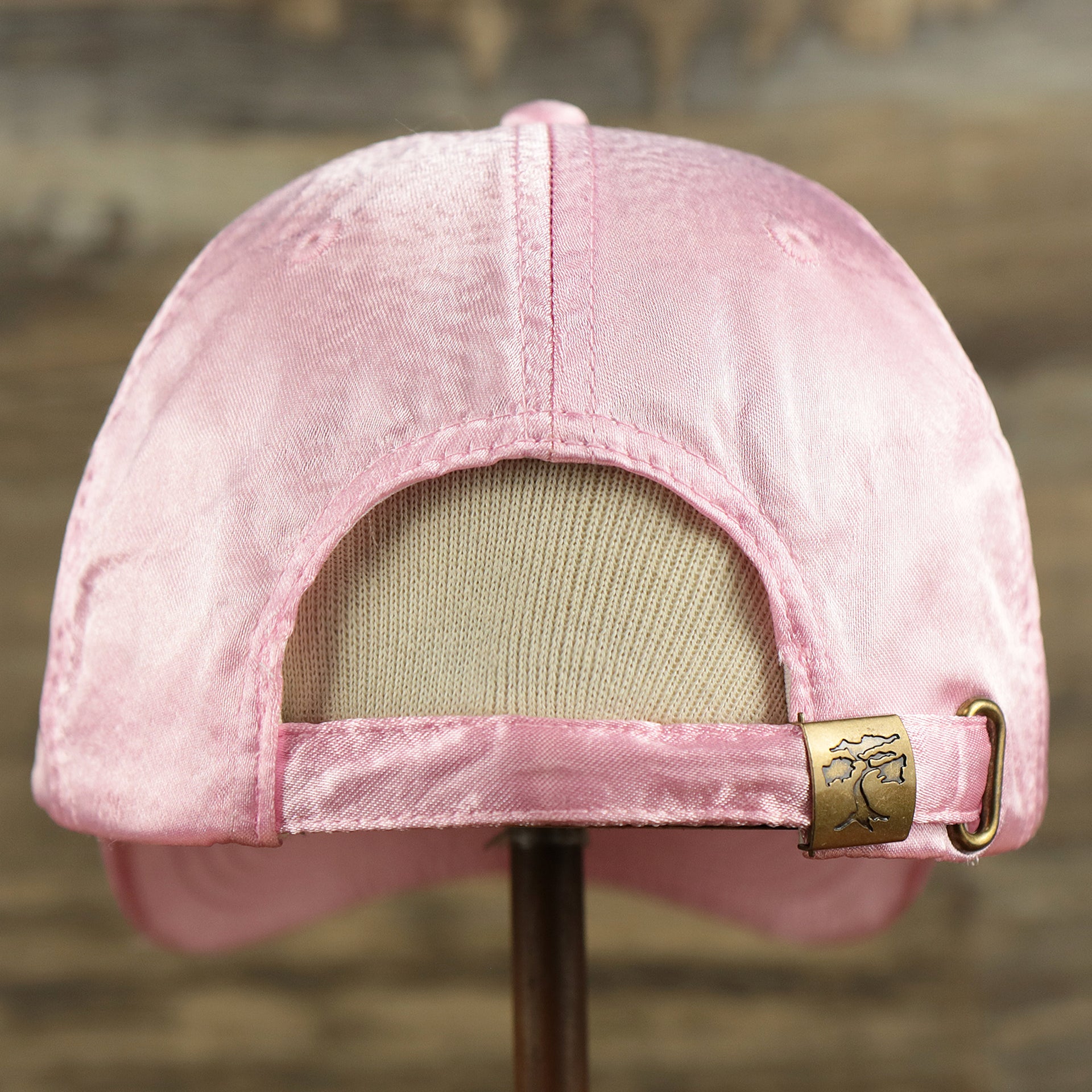 The backside of the Satin Blank Cherry Blossom Pink Baseball Hat | Light Pink Dad Hat