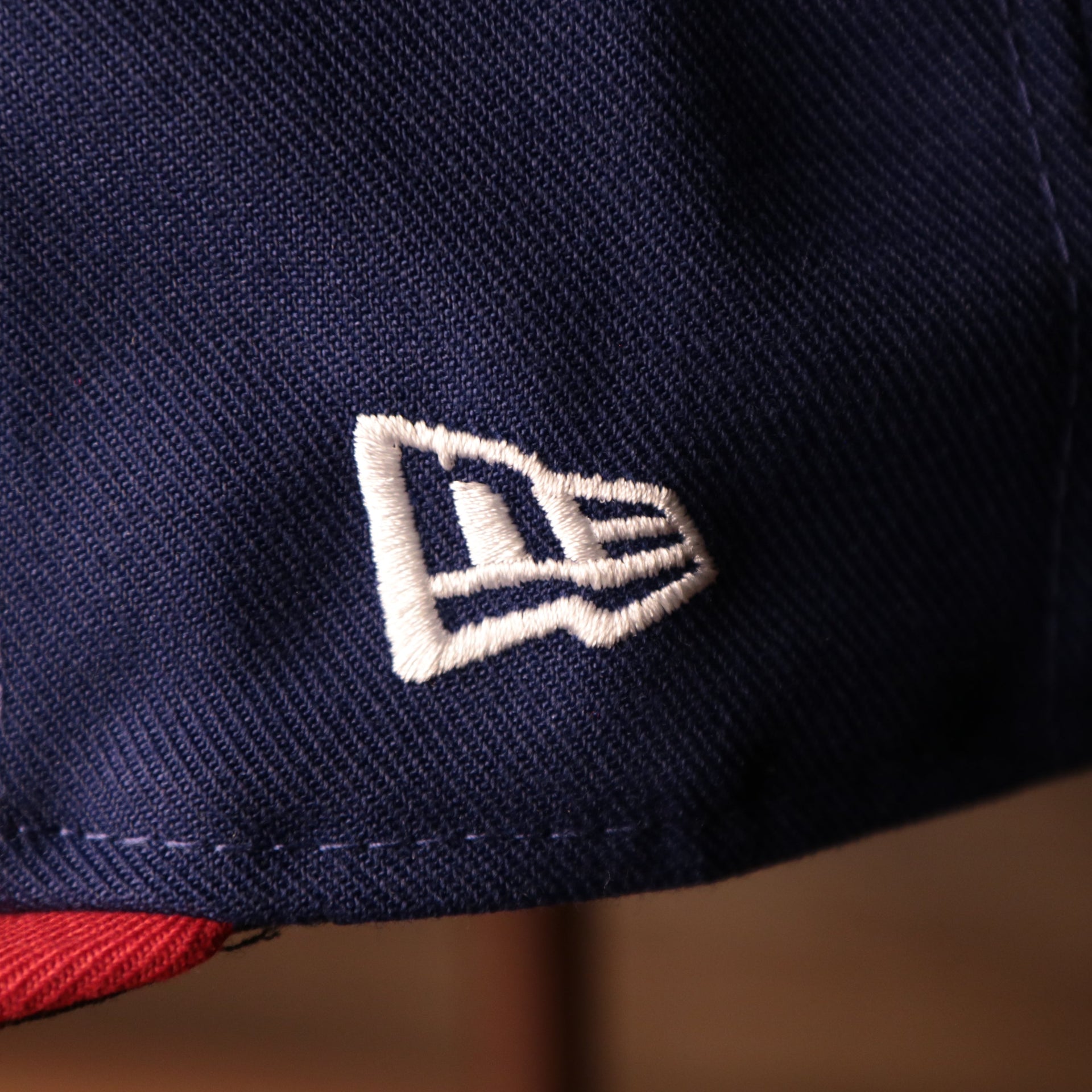 The New Era Logo on the Philadelphia Phillies Blue on Red Game Authentic 59Fifty Fitted Cap