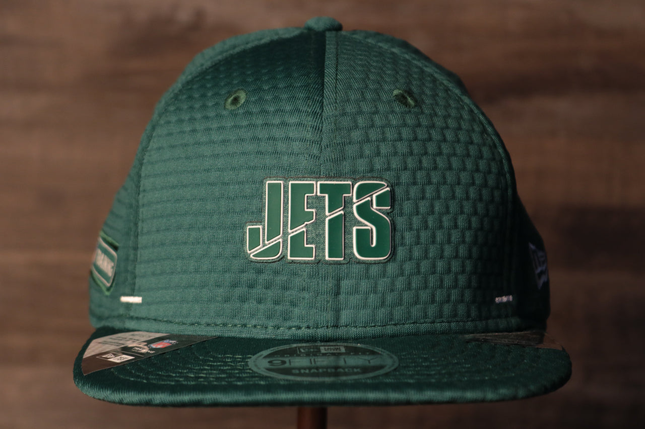 Jets 2020 Training Camp Snapback Hat | New York Jets 2020 On-Field Green Training Camp Snap Cap the front of this jets training cap has the jets name and a flatbrim
