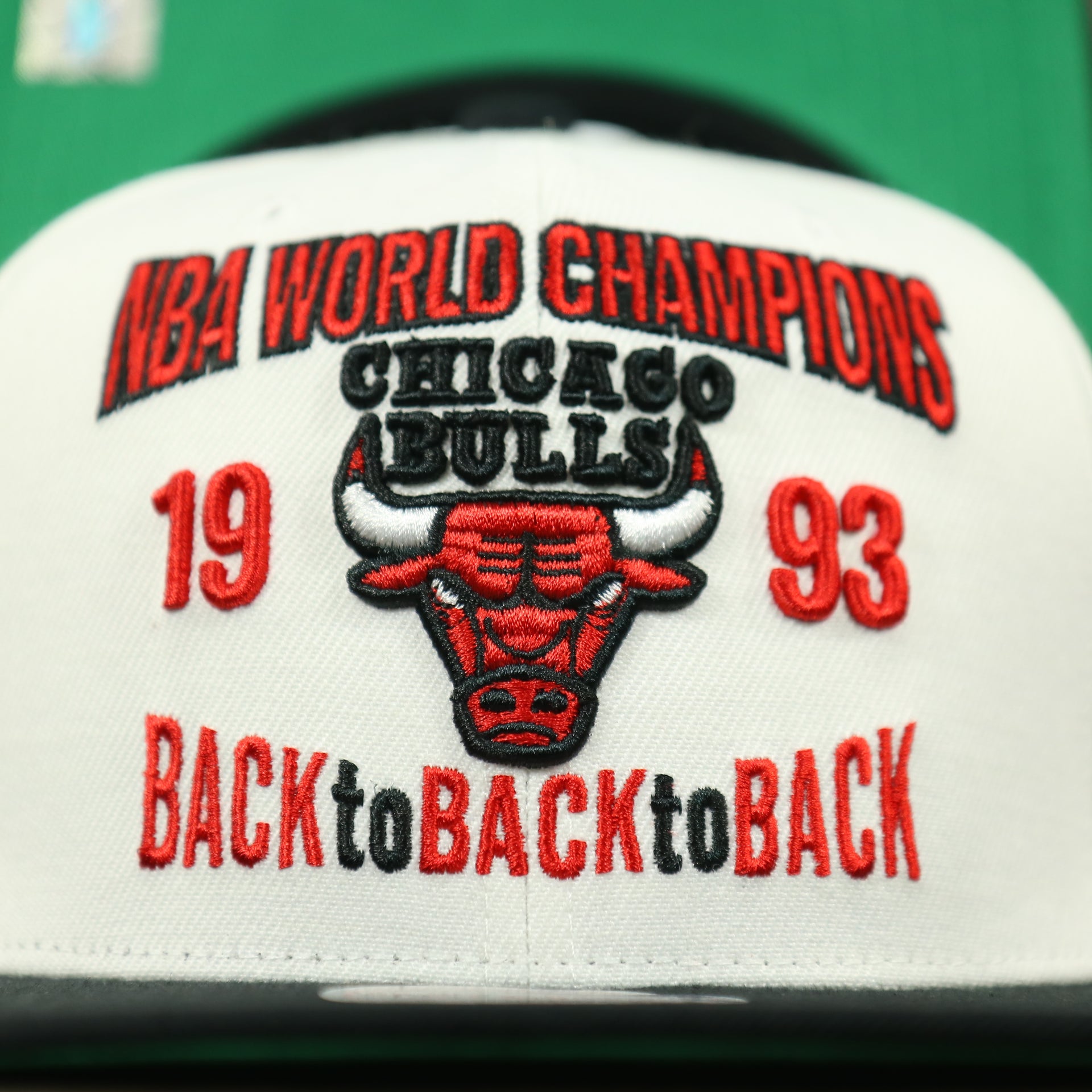 1993 logo on the front of the Chicago Bulls Vintage Retro NBA Champions 1993 Back To Back To Back Mitchell and Ness Snapback Hat | White