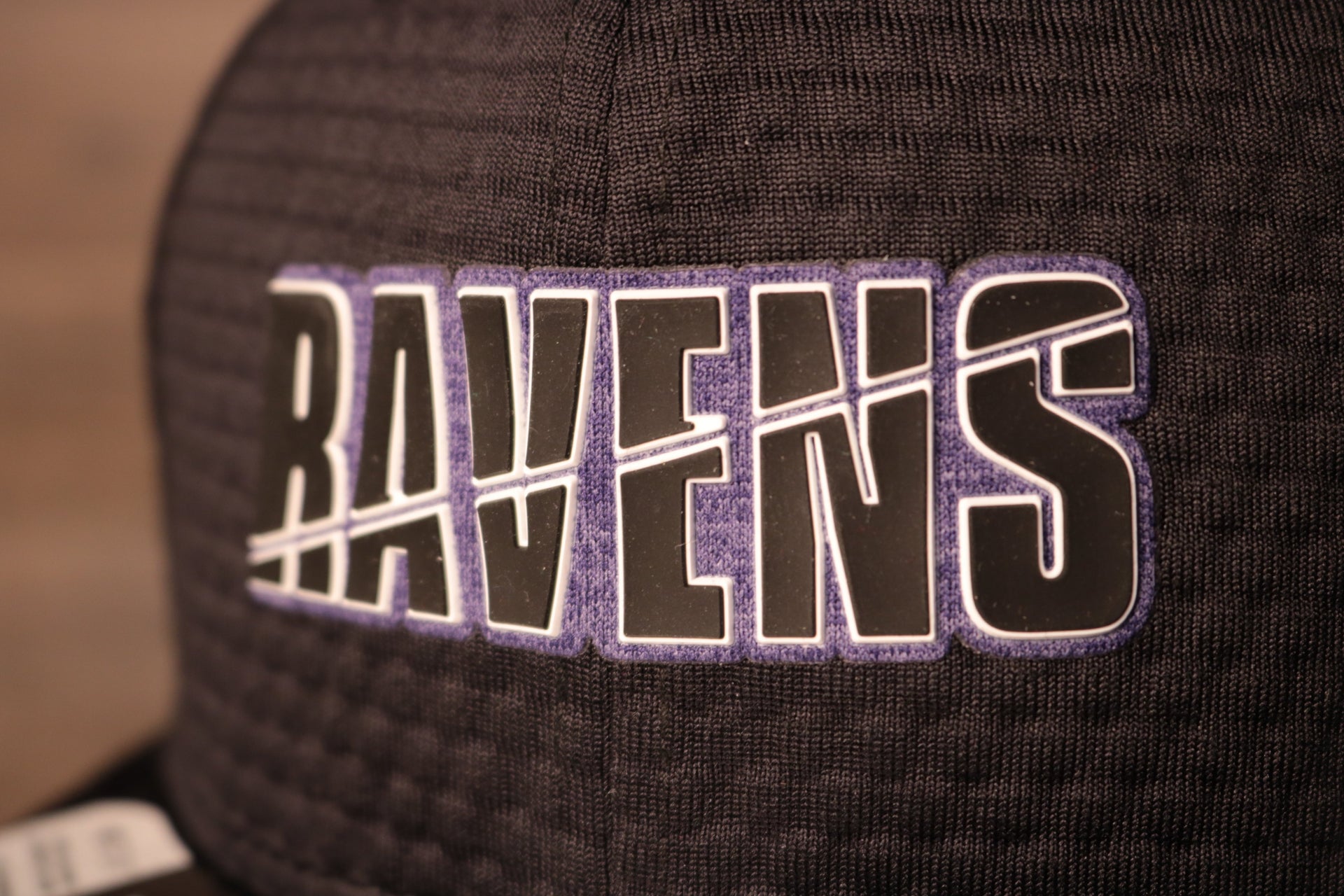 Ravens 2020 Training Camp Snapback Hat | Baltimore 2020 On-Field Black Training Camp Snap Cap the ravens logo is purple with a back background