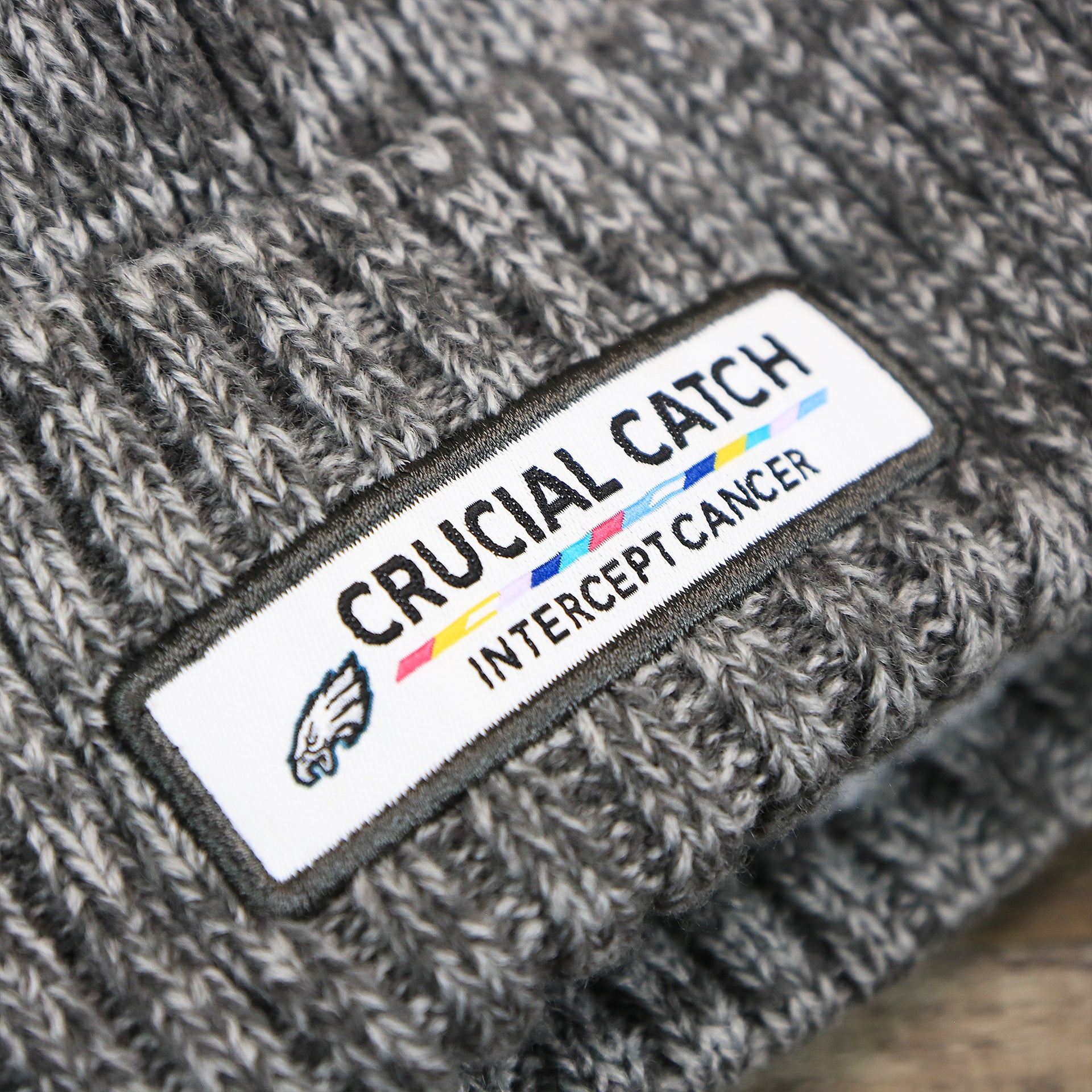 The Crucial Catch Patch on the Philadelphia Eagles On Field Crucial Catch Patch NFL Winter Beanie | Graphite Winter Beanie
