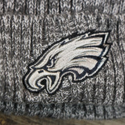 The Eagles Logo on the Philadelphia Eagles On Field Crucial Catch Patch NFL Winter Beanie | Graphite Winter Beanie