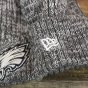 The New Era Logo on the Philadelphia Eagles On Field Crucial Catch Patch NFL Winter Beanie | Graphite Winter Beanie