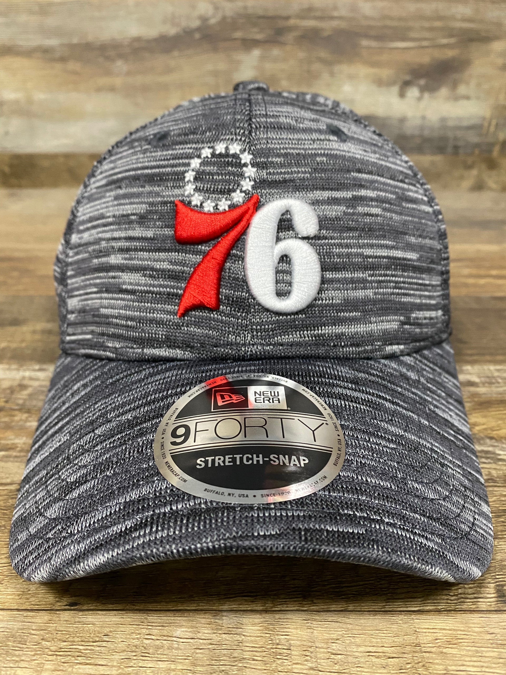 on the front 76ers Trucker hat | Philadelphia sixers  Flyknit Look Space Dye Gray Trucker Dad Hat