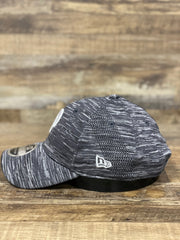 on the side of the Philadelphia Phillies Retro Logo Space-Dye Gray Trucker Dad Hat is an embroidered New Era logo
