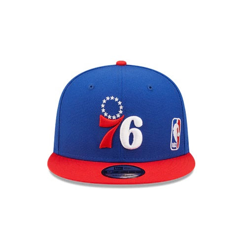 The front of the Philadelphia 76ers Red Letter Arch Vintage Green Bottom NBA 9Fifty Snapback Hat | Back Letter Arch Royal Blue 9Fifty