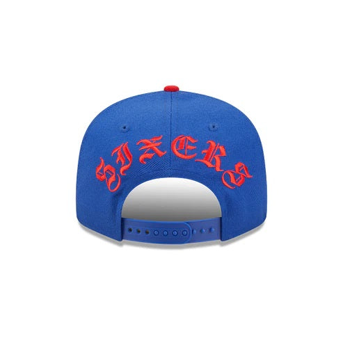 The backside of the Philadelphia 76ers Red Letter Arch Vintage Green Bottom NBA 9Fifty Snapback Hat | Back Letter Arch Royal Blue 9Fifty