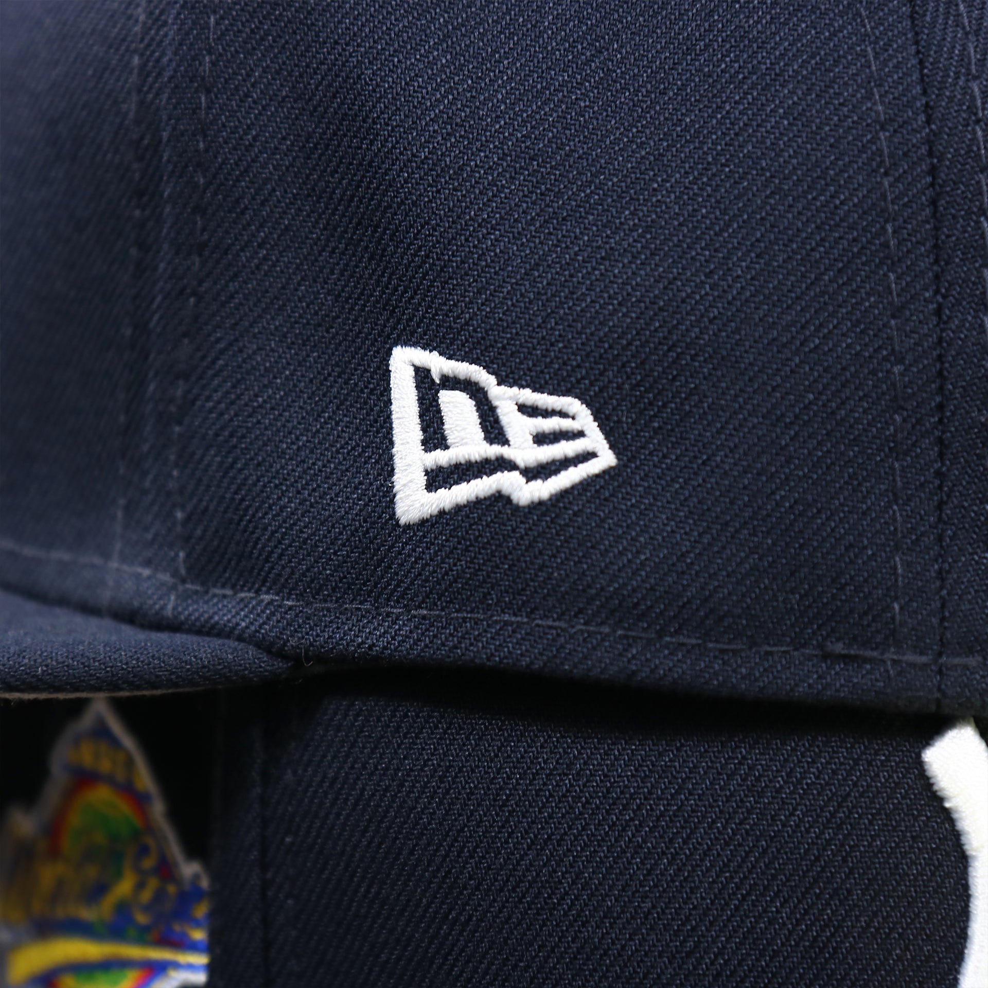 The New Era Logo on the New York Yankees Baseball Heart Gray Bottom World Series 59Fifty Fitted Cap | Navy 59Fifty Cap