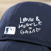The MLB Batterman Logo and Love & Hustle = Game Text on the New York Yankees Baseball Heart Gray Bottom World Series 59Fifty Fitted Cap | Navy 59Fifty Cap