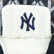 The Yankees Logo on the New York Yankees Winter Print Trapper Hat | Navy Blue Trapper Hat