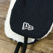 The New Era Logo on the New York Yankees Winter Print Trapper Hat | Navy Blue Trapper Hat