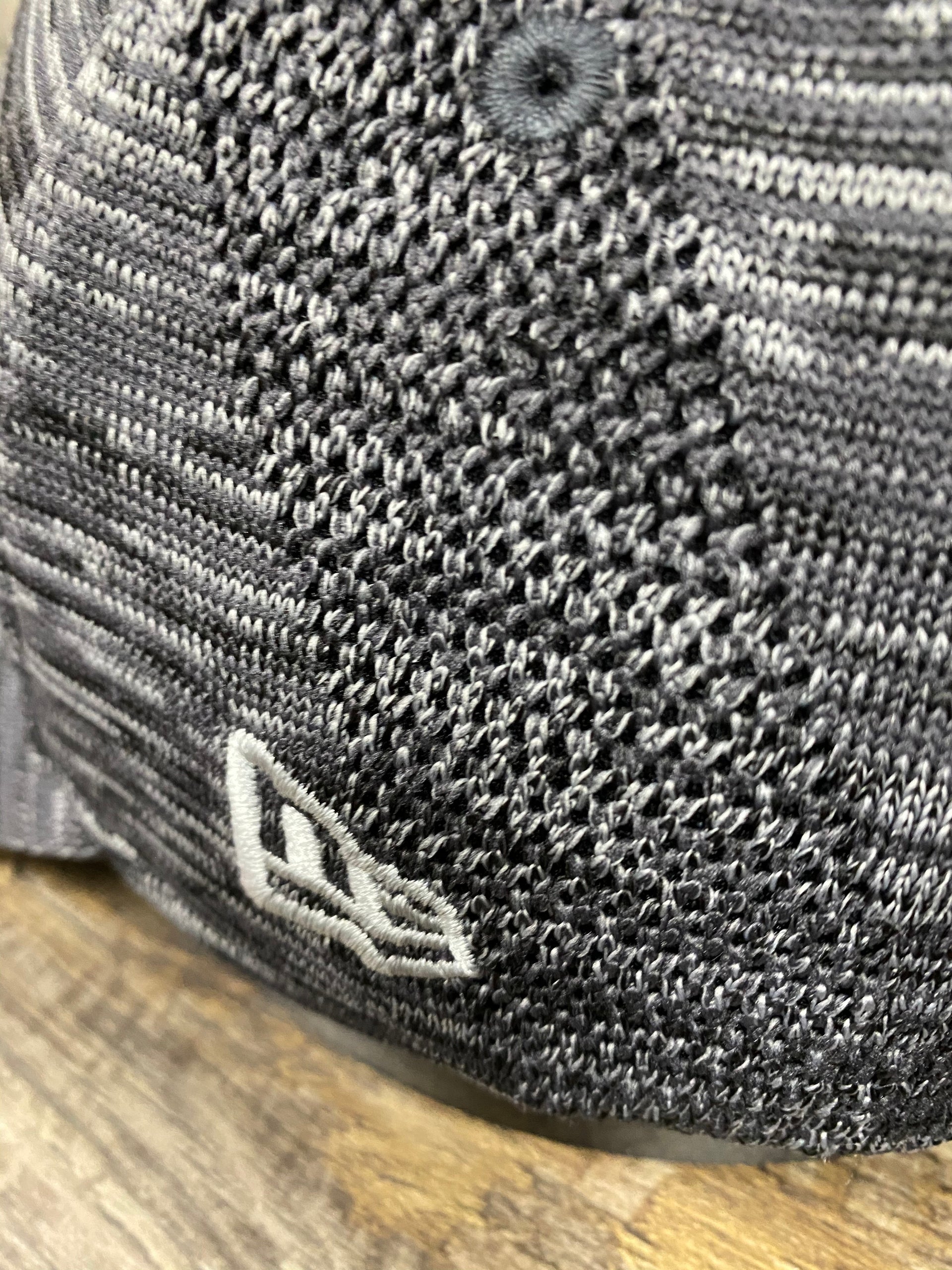 on the side of the Philadelphia Phillies Retro Logo Space-Dye Gray Trucker Dad Hat is flyknit knit details