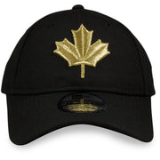 the Toronto Raptors 2019 NBA City Series Black Dad Hat | Metallic Gold Leaf Logo Raptors Baseball Cap has a shiny gold maple leaf on the front