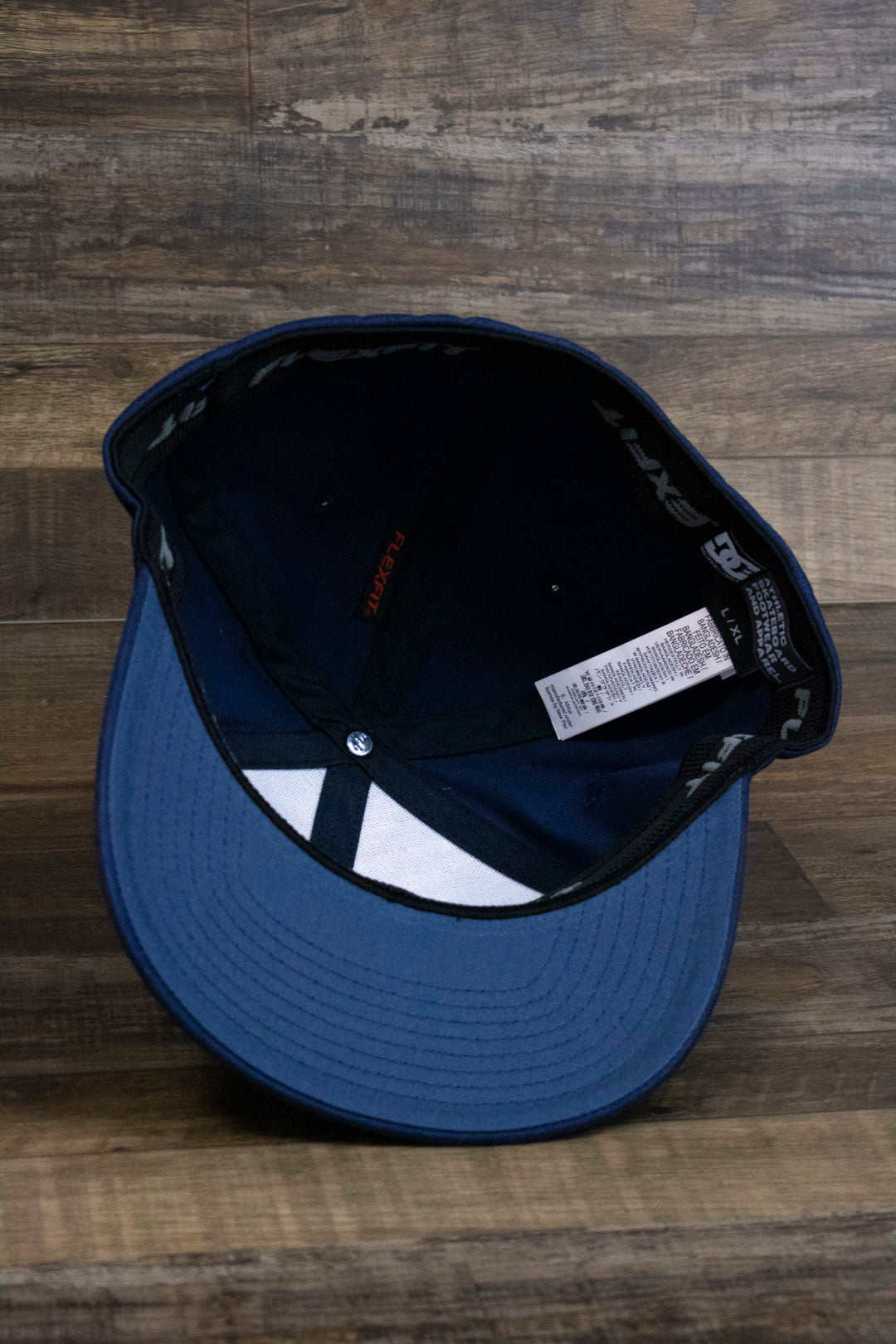 the Navy Blue Skater Hat | DC Shoes Blue Bottom Navy Flexfit Cap has a blue bottom