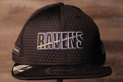 Ravens 2020 Training Camp Snapback Hat | Baltimore 2020 On-Field Black Training Camp Snap Cap the front of this ravens cap has the ravens name on the front