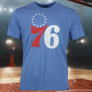 front of the Philadelphia 76ers Distressed Throwback Logo Cadet Blue Premium Franklin T-Shirt