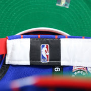 The NBA Tag on the Philadelphia 76ers City Arch Striped 9Fifty Snapback Cap | Royal Blue 9Fifty Cap