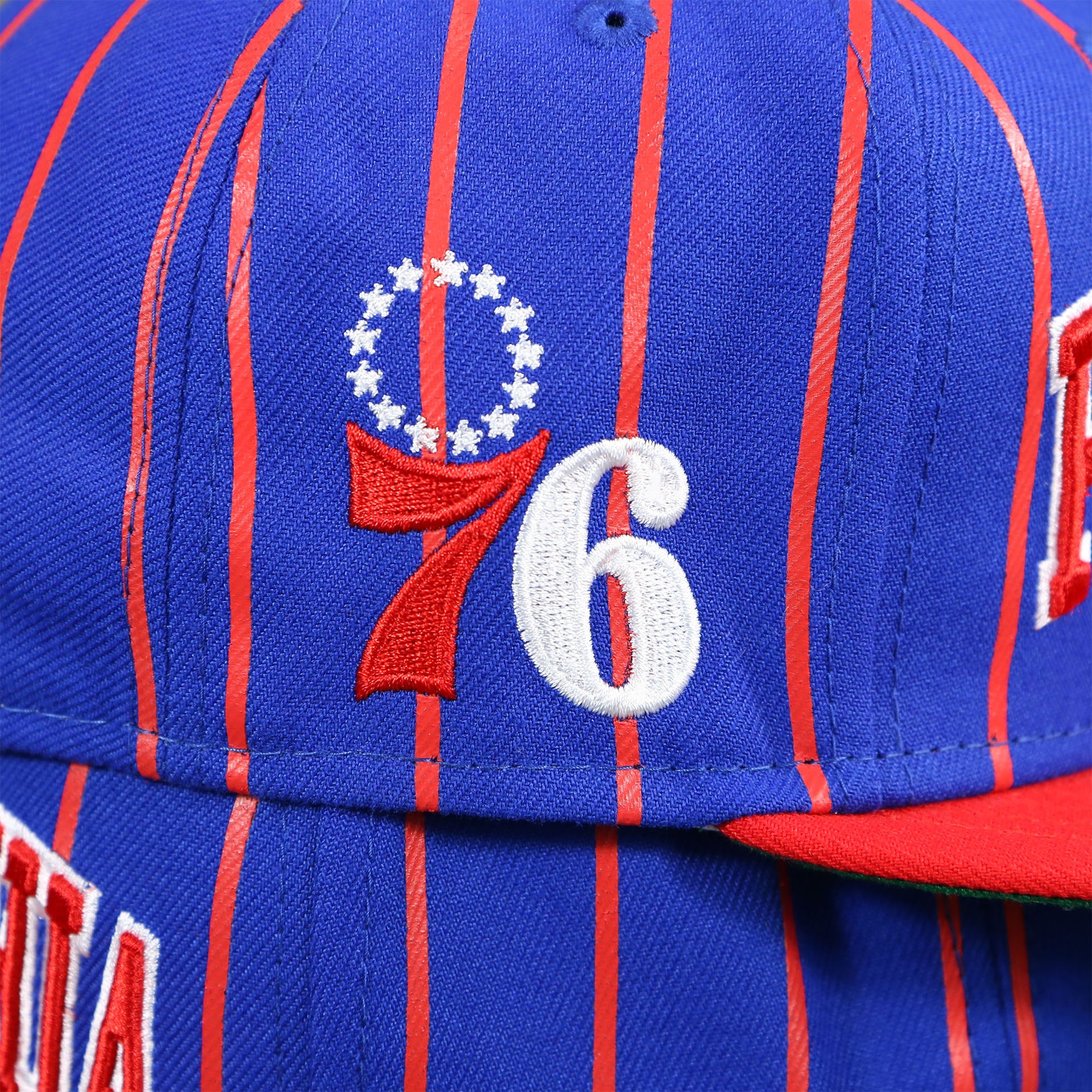 The Philadelphia 76ers Patch on the Philadelphia 76ers City Arch Striped 9Fifty Snapback Cap | Royal Blue 9Fifty Cap