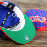 The Undervisor on the Philadelphia 76ers City Arch Striped 9Fifty Snapback Cap | Royal Blue 9Fifty Cap