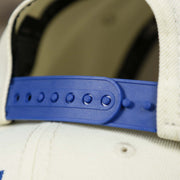 The adjustable strap on the Philadelphia 76ers NBA 2022 Draft Gray Bottom 9Fifty Snapback | New Era Cream/Royal Blue