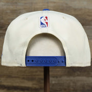 The backside of the Youth Philadelphia 76ers NBA 2022 Draft Gray Bottom 9Fifty Snapback | New Era Cream/Royal Blue