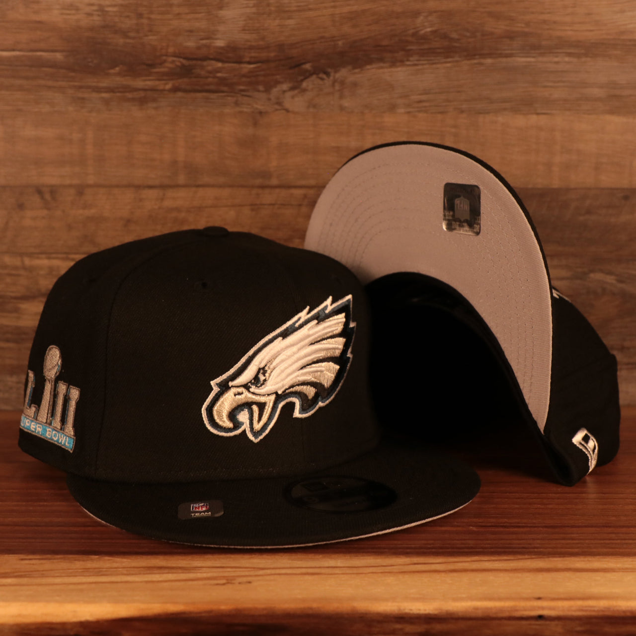 front and bottom of the Philadelphia Eagles "Patch Up" Super Bowl LII Side Patch Gray Bottom 9Fifty Black Snapback Hat
