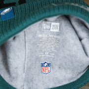 The Lining on the Philadelphia Eagles On Field Since 1933 Eagles Patch Winter Pom Pom Beanie | Midnight Green Winter Beanie